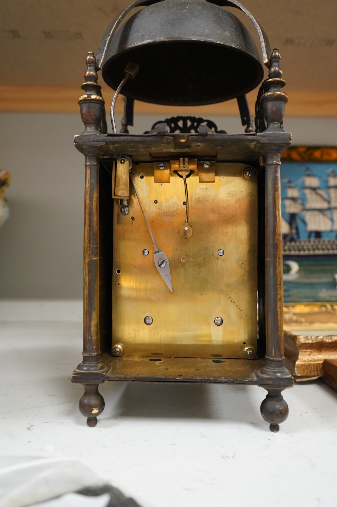 A 19th century brass lantern clock with engraved dial, twin fusee movement pendulum and key, 39cm high